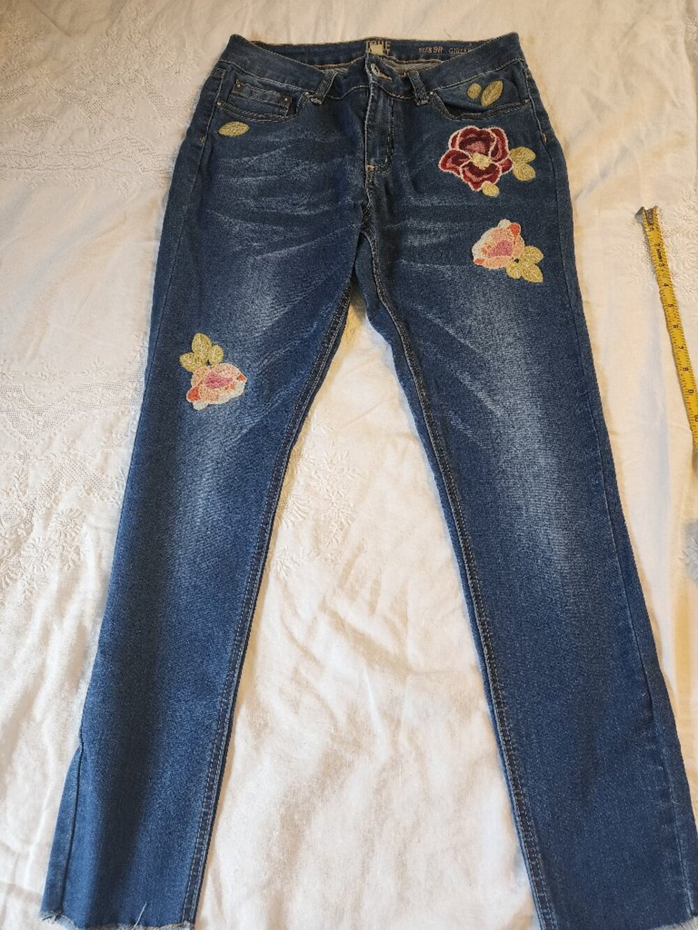 Floral embroidered jeans size 8